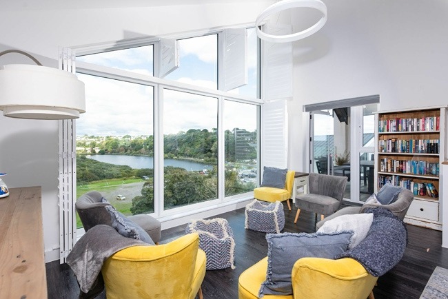 Seaview property, relaxing living space with bookcase - Swanpool View