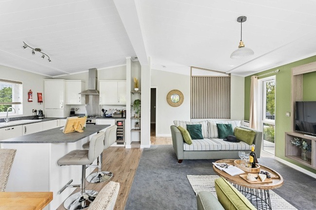 Open plan living area with access to kitchen and dining areas - Rose Lodge