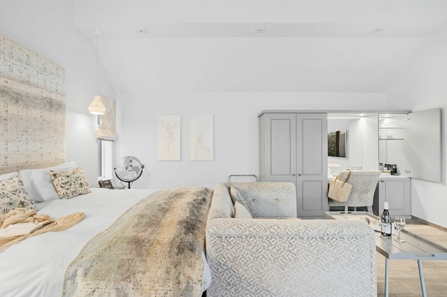 Open plan interior with seati ng for 2 and King size bed - Cottage Suite 2, Kentisbury Grange
