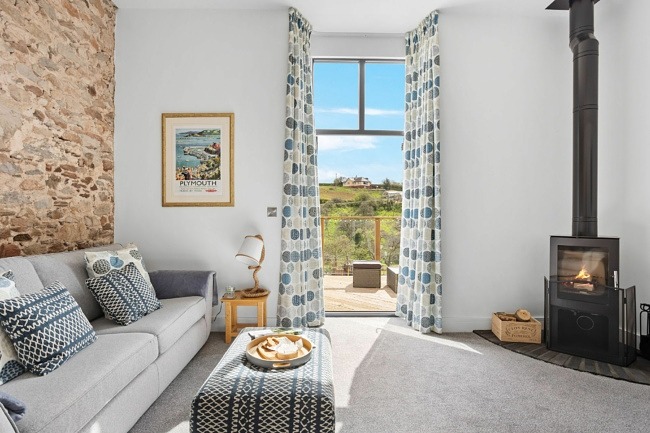 Cosy fireplace and comfortable sofa with a view - The Linhay 