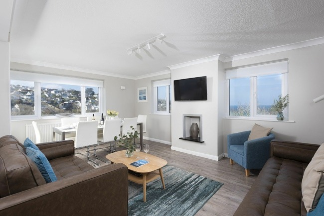 An open planned living/kitchen/dining area with views to the sea - Fairsky