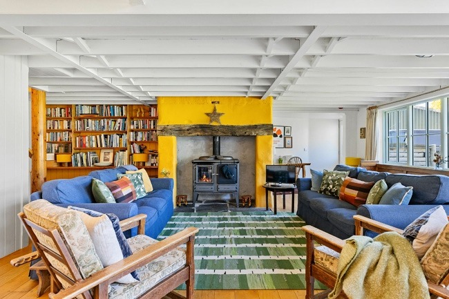 Living area with wood burning stove - Master Shipwrights House