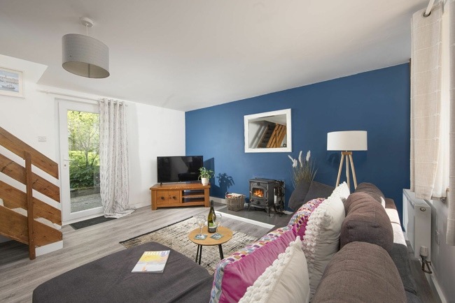 Living area with Smart LED TV and log burner - Aval Dor Barn