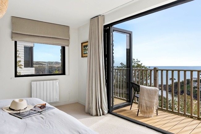 Bi-fold doors opening onto balcony from the master bedrom - Murrawingi