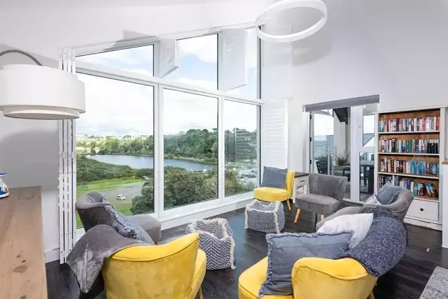 Seaview property, relaxing living space with bookcase - Swanpool View