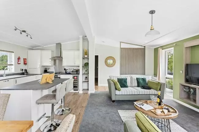 Open plan living area with access to kitchen and dining areas - Rose Lodge