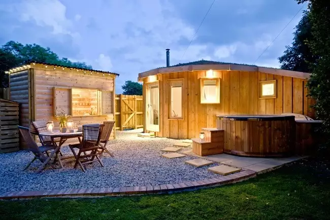 The Secret Roundhouse lit up at night - The Secret Roundhouse