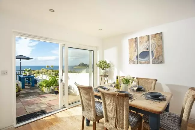 Dinning area with outdoor access with views of St Michael's Mount - Ty Bryn
