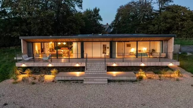 Property full lit up during dusk - Field House